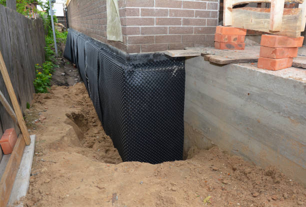 SJ Waterproofing Pros technician performing targeted Waterproofing assessment in Carrollton, AL